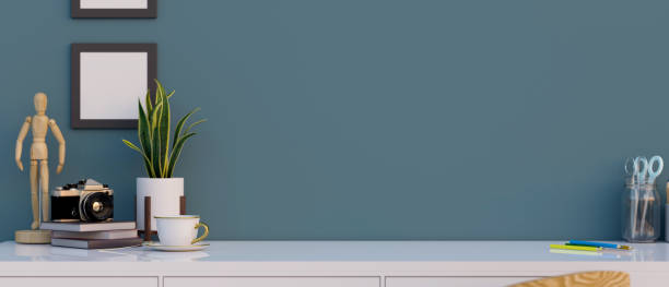 istock A table top with home decorations and copy space over blue wall. 1364320816