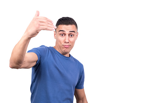 Studio photo with white background of a man waving his hand indicating someone to come forward