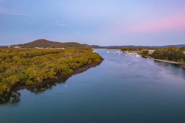 istock Sunset waterscape with boats 1364332598
