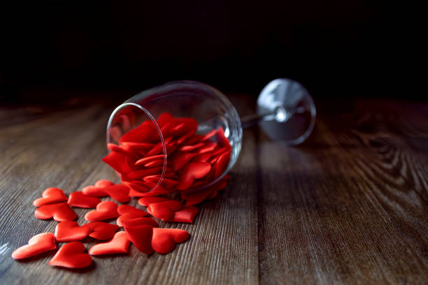istock A glass filled with red hearts on a dark background. Valentine's Day. 1364334674