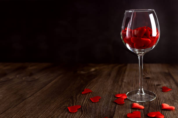 istock A glass filled with red hearts on a dark background. Valentine's Day. 1364335458