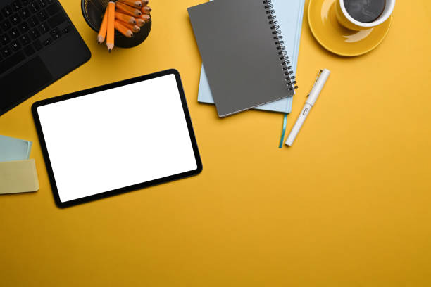 istock Top view creative workspace with digital tablet, notebook, coffee cup and pencil holder. 1364337845