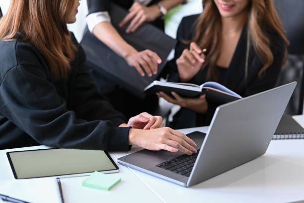 istock Group of business people sharing ideas or startup business plan together. 1364338030