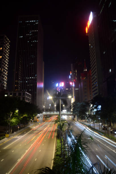 Traffic light trails on Gloucester road by night, Wan Chai district, Hong Kong island