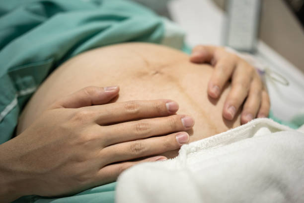 istock A pregnancy mother hugging her baby. 1364339474