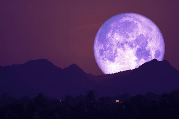 istock rose moon on night sky back over silhouette mountain 1364343550