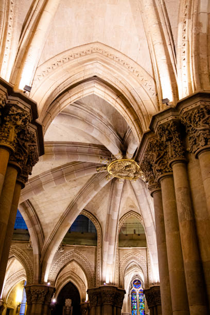 istock Interior pillars and masonry of a cathedral with stained glass windows 1364344597