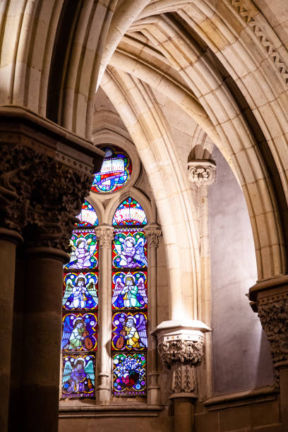 istock Interior pillars and masonry of a cathedral with stained glass windows 1364344606