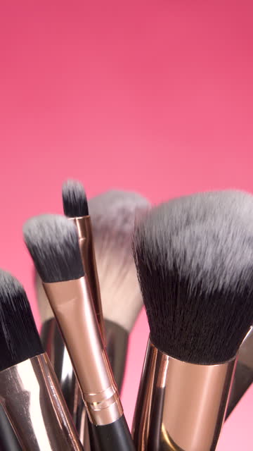cosmetics brushes set for makeup on pink background. Cosmetics and beauty concept. Make up concept with space for text