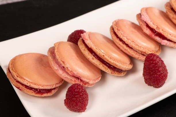 istock Pastry, Macaroon recipe with raspberry cream filling 1364349498