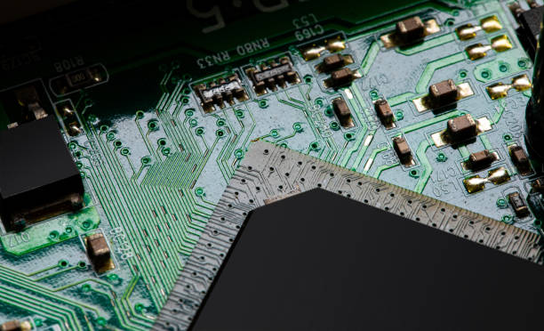 istock Close up of components and microchips on PC circuit board 1364350105