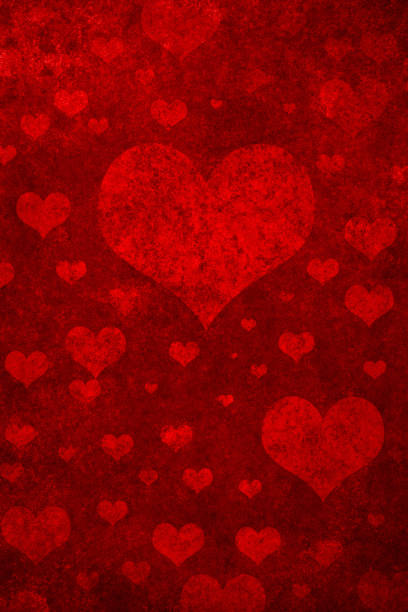 istock Grunge red background with heart shapes 1364351432