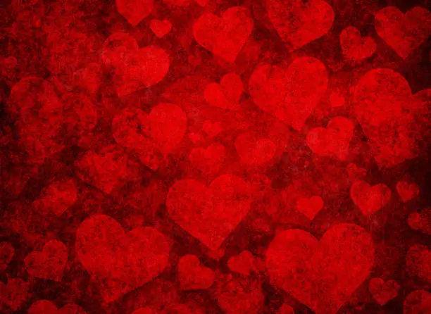 Photo of Grunge red background with heart shapes