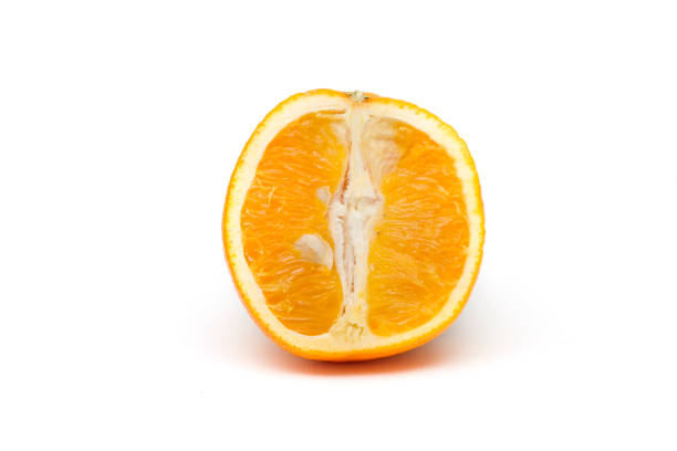 istock An isolated orange cut in half. 1364352391