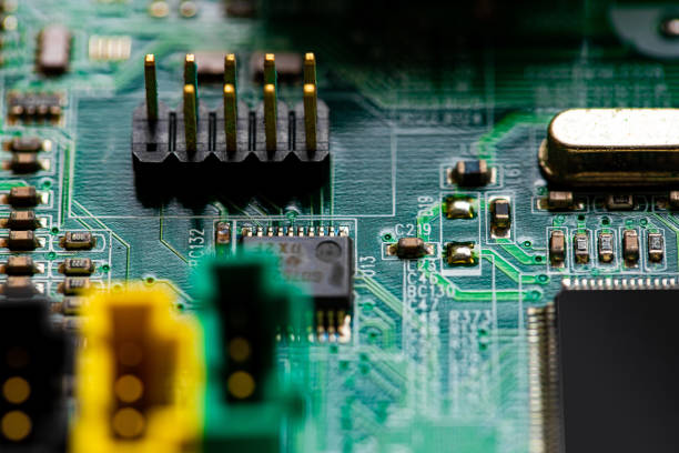 istock Close up of components and microchips on PC circuit board 1364352527