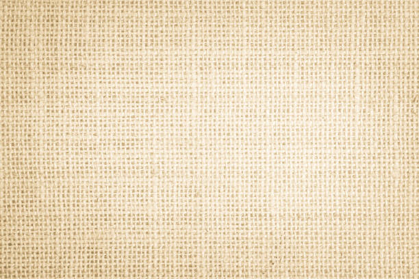 istock Jute hessian sackcloth burlap canvas woven texture background pattern in light beige cream brown color blank. Natural weaving fiber linen and cotton cloth texture as clean empty for decoration. 1364353964