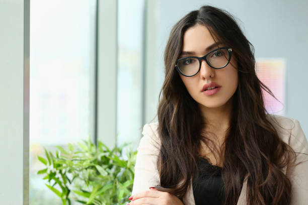 istock Beautiful smiling girl at workplace look in camera 1364354641