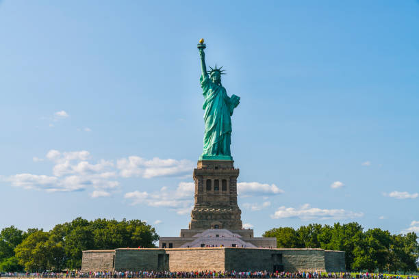 istock The statue of Liberty  with blue sky background. 1364354905