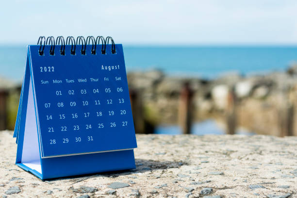 istock Blue August 2022 calendar on blurred background of blue ocean 1364357080
