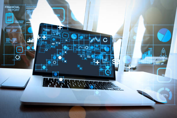 istock Office workplace with blank screen laptop and smart phone on wood table 1364358817