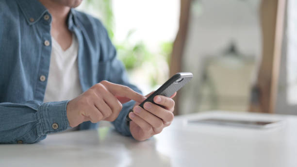 istock Close Up of Hand using Smartphone, Mobile 1364360140