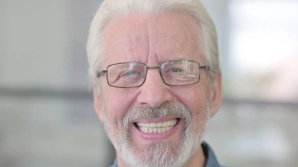 istock Face of Old Man Smiling at the Camera 1364360561