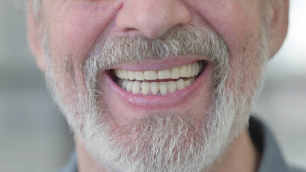 istock Smiling Lips of Old Man 1364361903
