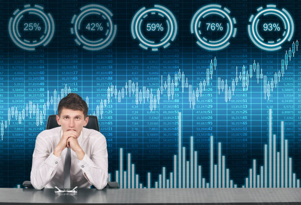 istock Trader man and spreadsheet, stock and percentage charts on virtual screen. 1364362314