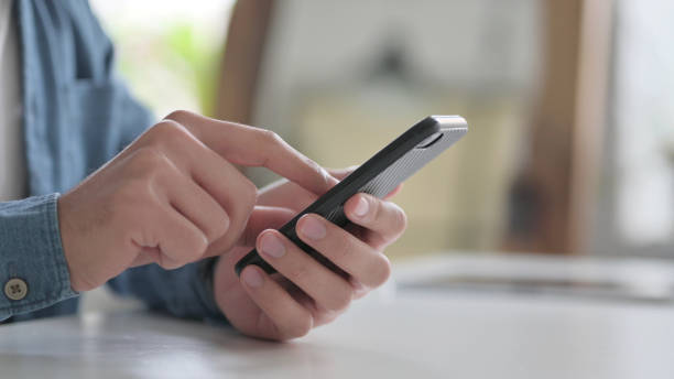 istock Close Up of Hand Typing on Smartphone 1364362354