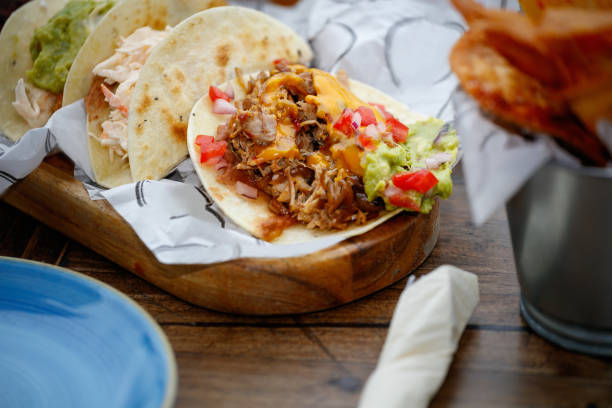 istock Folded tortilla with meat filling served on restaurant table 1364363293