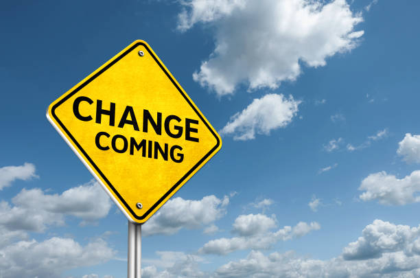 Change Coming information road sign stock photo