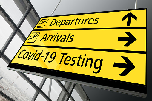 Airport terminal sign Covid-19 testing travel
