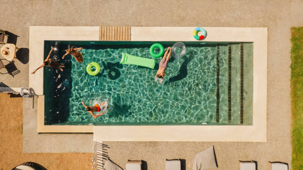 istock Having fun at the swimming pool 1364367812