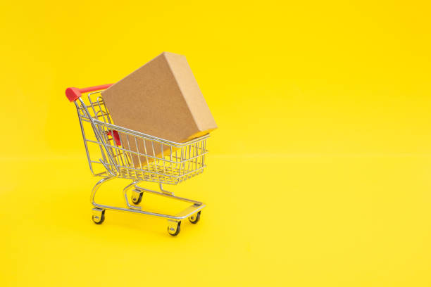 istock Shopping trolley with cardboard box. Copy space for promo text 1364368643