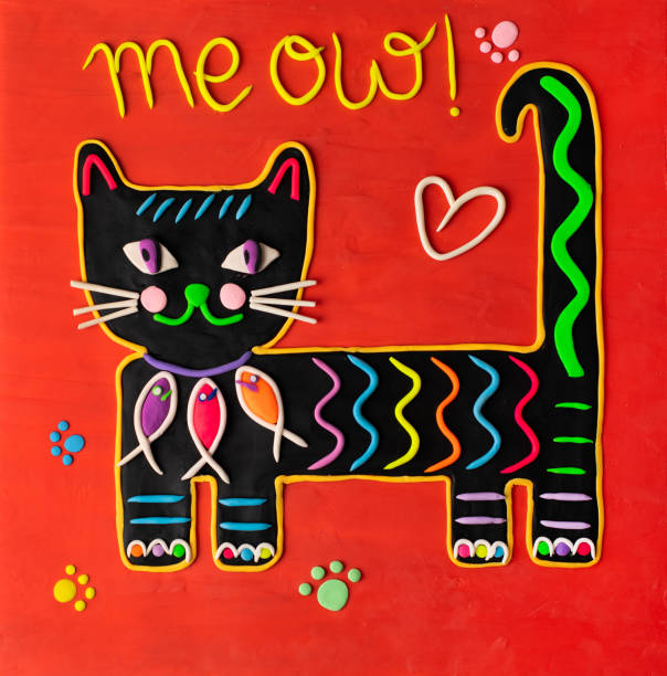 istock cute handmade craft plasticine cat with a red background 1364368856