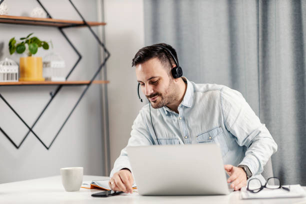 istock An entrepreneur sitting at his home office and preparing for a video call. 1364369840