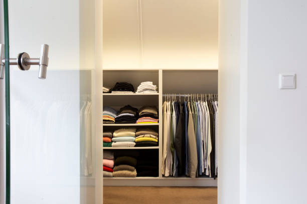 istock walk -in closet with cloth and shelf at home modern stylish white design, interior storage concept 1364370950