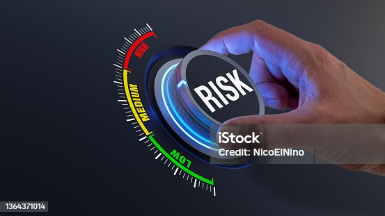 istock Risk management and mitigation to reduce exposure for financial investment, projects, engineering, businesses. Concept with manager's hand turning knob to low level. Reduction strategy. 1364371014