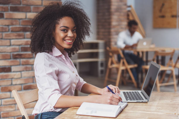 istock Beautiful Afro-American woman working 1364372030