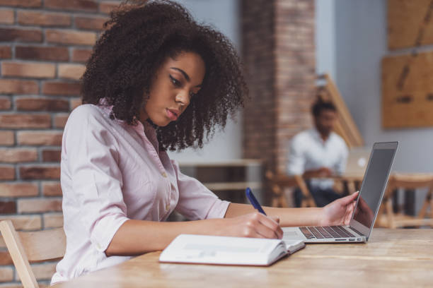 istock Beautiful Afro-American woman working 1364372323