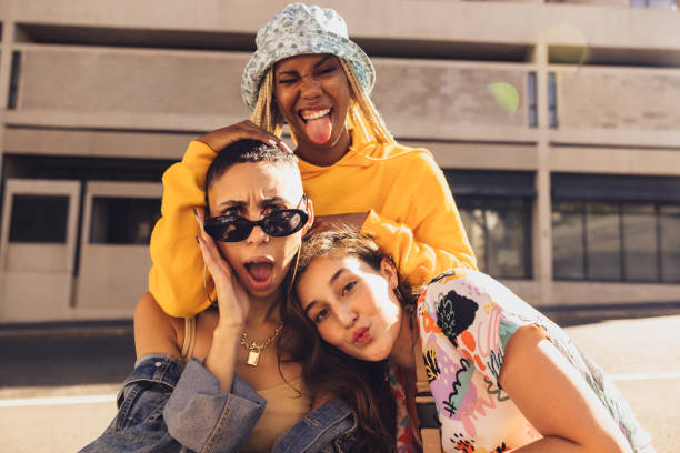 istock Three female friends having fun together outdoors 1364374819