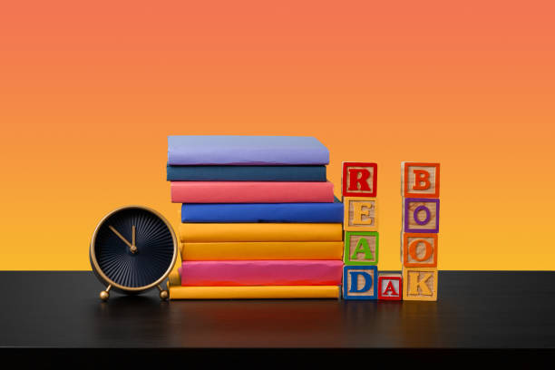 istock Stack of books on black wooden table 1364378554