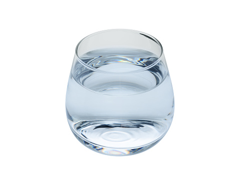 Transparent glass of water, on a white background. Close-up
