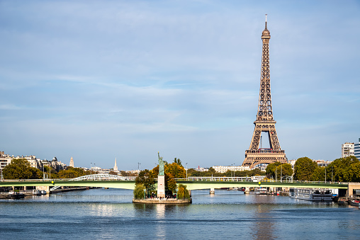 Sunrise behind the Eiffel Tower and Seine River in Paris