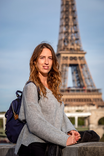 European tourist woman in front of Eiffel Tower in Paris