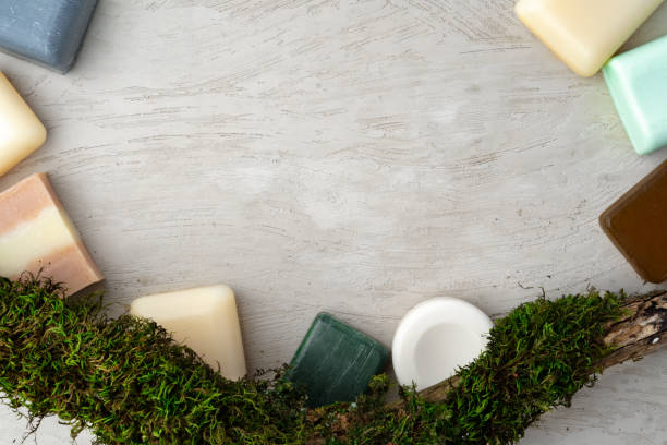 istock Natural handmade soap and plants on gray background 1364380694
