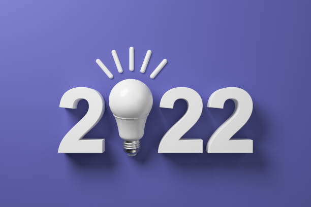 istock 2022 and white LED lamp on a purple background. 1364382602