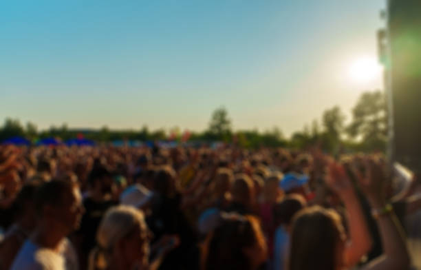 istock People watching music concert on large stage. Blurred image. 1364382805