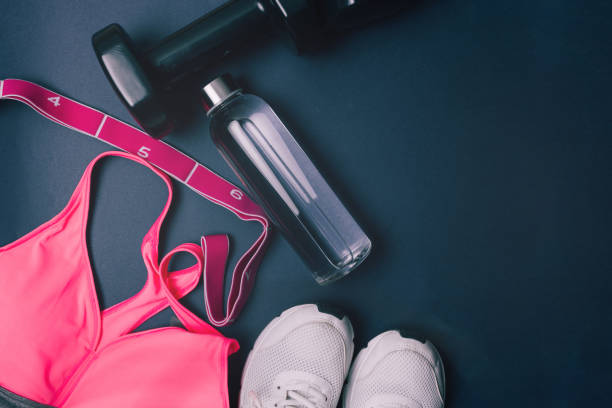 istock Fitness equipment on a dark background with copy space. 1364382979