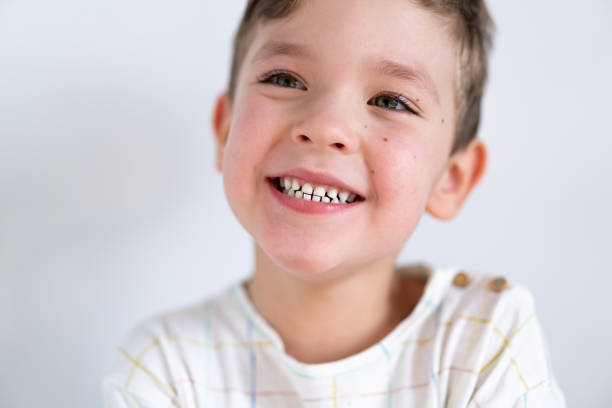 Portrait of a cute boy smiling with white healthy teeth. Emotions of a child. Smiling child boy. Portrait of a cute boy smiling with white healthy teeth. Emotions of a child. Smiling child boy. Cheerful cheerful kid. Happy child. Funny baby boy isolated on a white background baby teeth stock pictures, royalty-free photos & images
